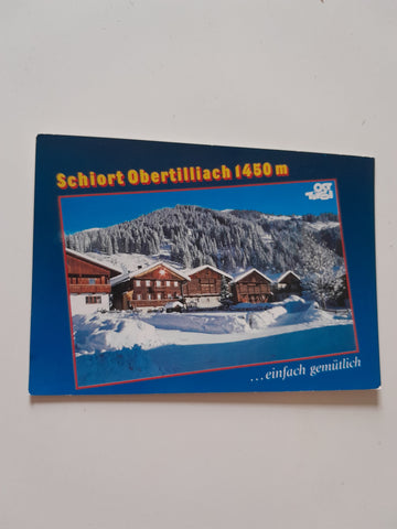 AK Obertilliach. Alte Bauernhäuser im Ortszentrum.