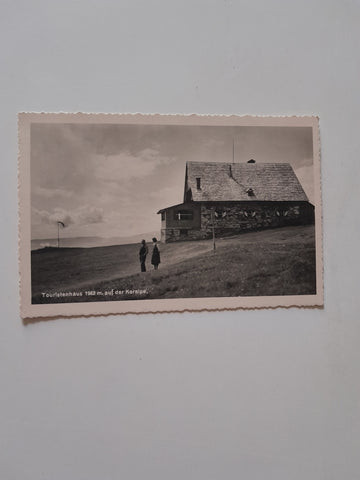 AK Touristenhaus mit der Koralpe. (1936)