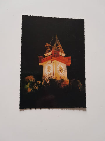AK Graz. Uhrturm am Schloßberg bei Nacht.