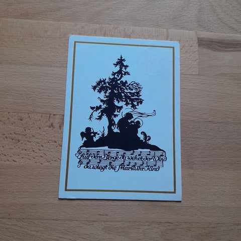Scherenschnittkarte Elisabeth Emmler. "Auf dem berge da wehet der Wind da wiegt die Maria ihr Kind.