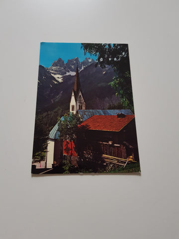 AK Falcade. Valle del Biois. La chiesa con le cime del Focobon.