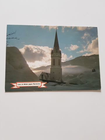 AK Lienz im Winter gegen Pfarrkirche.