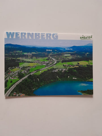 AK Panorama über den Ferienort Wernberg gegen den Wörther See.