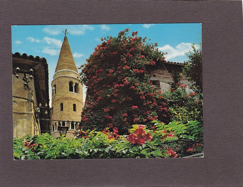 AK Caorle. Siamo in vacanza. Fiori e antico campanile di paese.
