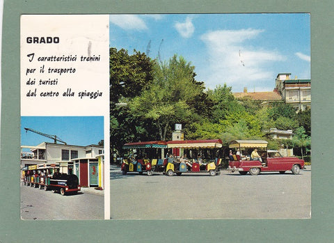 AK Grado. I caratteristici trenini per il trasporto die turisti dal centro alla spiaggia.