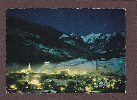 AK Winterliche Vollmondnacht über der alten Bergstadt Schladming.
