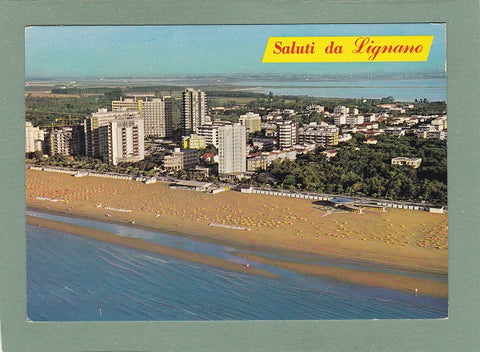 AK Saluti da Lignano. Veduta aerea di via Corinzia.