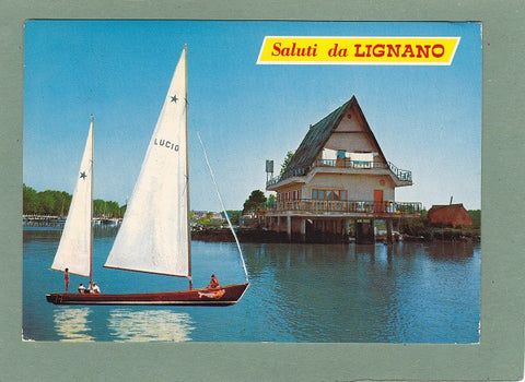 AK Saluti da Lignano. Barca sportiva all'ingresso della darsena.