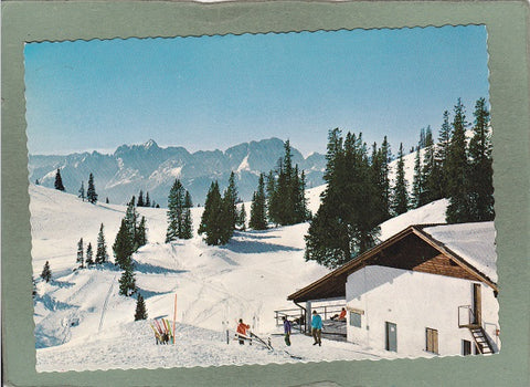 AK Wintersportgebiet Villacher Alpe Talstation des Höhenraain-Sesselliftes gegen die Julischen Alpen.