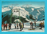 AK Skidorf Saalbach. Blick vom Schattberg zu den Hohen Tauern.